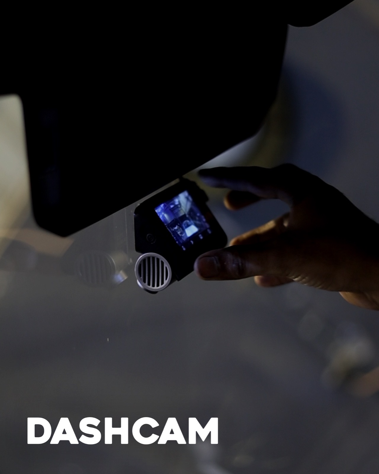 A dashcam held up behind the windscreen